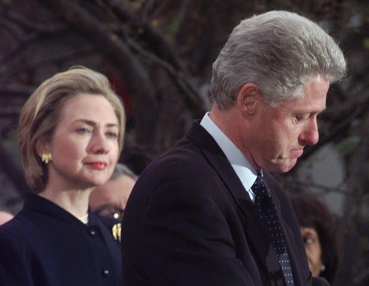 US President Bill Clinton makes a statement as first lady Hillary Rodham Clinton looks on at the White House on December 19, 1998, thanking those Democratic members of the House of Representatives who ...
