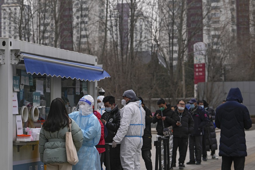 People line up to get tested at a mobile coronavirus testing facility a residential area in Beijing, Wednesday, Jan. 19, 2022. China has locked down parts of Beijing&#039;s Haidian district following  ...