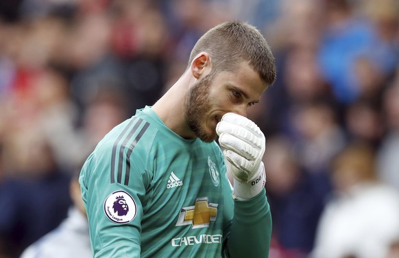 Manchester United goalkeeper David de Gea appears dejected after their English Premier League soccer match against Chelsea at Old Trafford, Manchester, England, Sunday, April 28, 2019. The game ended  ...