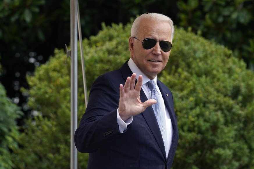 epa09342770 US President Joe Biden waves as he walks on the South Lawn of the White House in Washington, DC, USA, 13 July 2021, before his departure to deliver remarks on protecting the constitutional ...