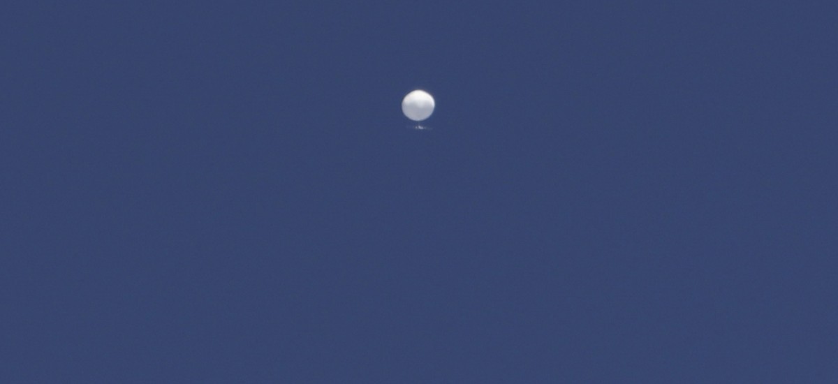 A balloon floats over Columbia, Mo., on Friday, Feb. 3, 2023. A huge, high-altitude Chinese balloon sailed across the U.S. on Friday, drawing severe Pentagon accusations of spying despite China's ...