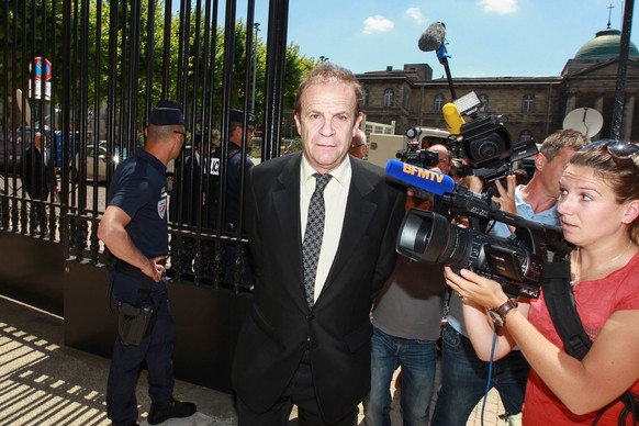 epa04772438 French artist and photographer, former confidant of France&#039;s richest woman Liliane Bettencourt, Francois-Marie Banier arrives prior to the verdict in the trial of ten people charged w ...