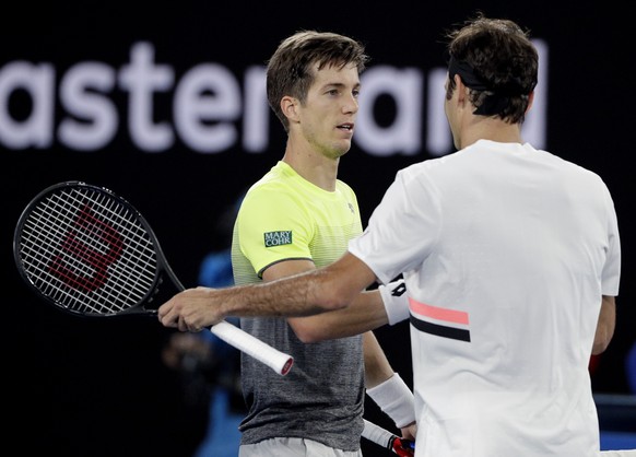 Switzerland&#039;s Roger Federer, right, is congratulated by Slovenia&#039;s Aljaz Bedene as Federer won their first round match at the Australian Open tennis championships in Melbourne, Australia, Tu ...