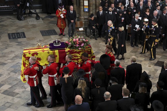 Britain's Queen Elizabeth's coffin is carried, as Britain's King Charles III, Camilla, the Queen Consort and Princess Anne follow, on the day of the state funeral and burial of Britain's Queen Elizabe ...