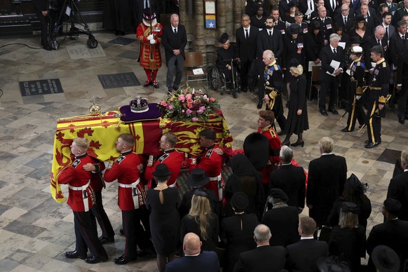 Britain&#039;s Queen Elizabeth&#039;s coffin is carried, as Britain&#039;s King Charles III, Camilla, the Queen Consort and Princess Anne follow, on the day of the state funeral and burial of Britain& ...