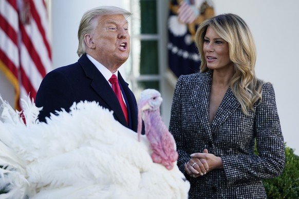 President Donald Trump speaks after pardoning Corn, the national Thanksgiving turkey, in the Rose Garden of the White House, Tuesday, Nov. 24, 2020, in Washington, as first lady Melania Trump watches. ...