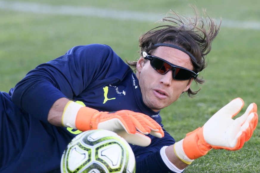 Swiss national team soccer goalkeeper Yann Sommer blocks a ball during a training session at the AEK FC Training Center, in Athens, Greece, Tuesday, March 20, 2018. Switzerland will play Greece in Ath ...