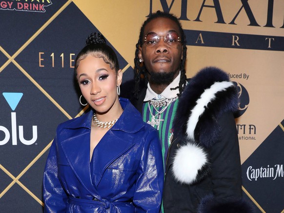 FILE- In this Feb. 3, 2018, file photo, Cardi B, left, and Offset arrive at the Maxim Super Bowl Party at the Maxim Dome in Minneapolis. Cardi B is asking the public to not bash Offset, who became the ...