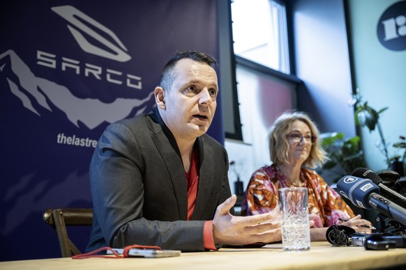 epa11483291 Florian Willet (L) and Fiona Stewart (R), co-presidents of the Last Resort organization, attend a press conference to present the death capsule &#039;Sarco&#039; developed by Exit Internat ...