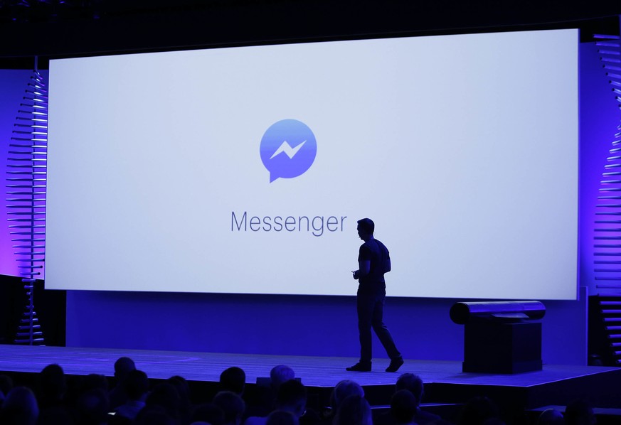 FILE - In this Tuesday, April 12, 2016 file photo, David Marcus, Facebook Vice President of Messaging Products, watches a display showing new features of Messenger during the keynote address at the F8 ...