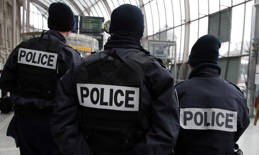 Police officers patrol in the railway station of the city of Strasbourg following a shooting, eastern France, Wednesday, Dec. 12, 2018. A man who had been flagged as a possible extremist sprayed gunfi ...