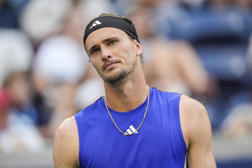Alexander Zverev, of Germany, reacts after losing a point against Brandon Nakashima, of the United States, during the fourth round of the U.S. Open tennis championships, Sunday, Sept. 1, 2024, in New  ...