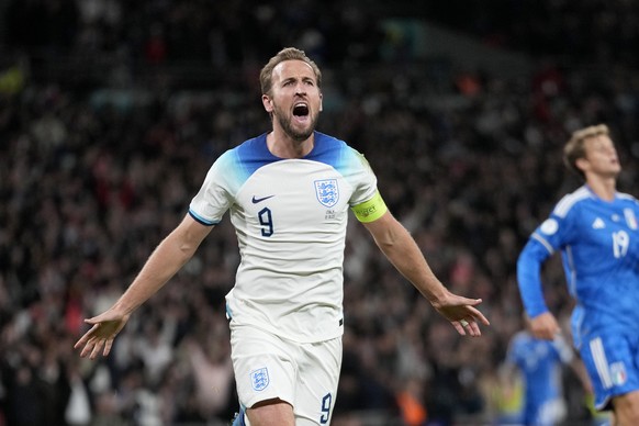 FILE - England&#039;s Harry Kane celebrates after scoring his side&#039;s third goal during the Euro 2024 group C qualifying soccer match between England and Italy at Wembley stadium in London, Tuesda ...