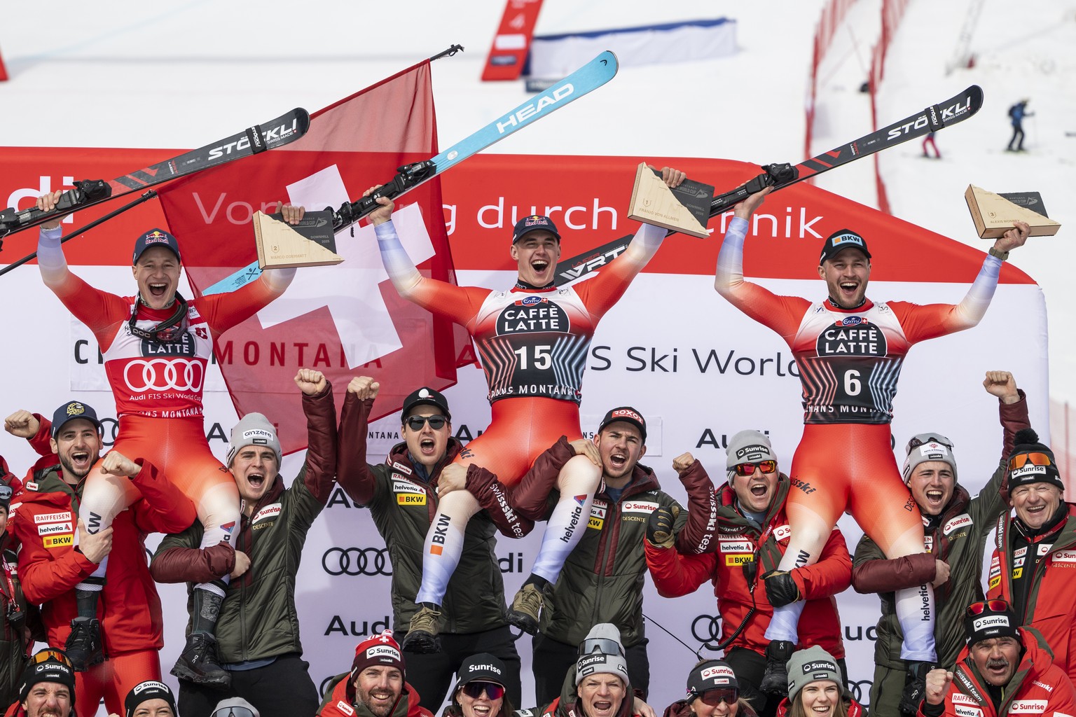KEYPIX - Winner Franjo von Allmen of Switzerland, center, second placed Marco Odermatt of Switzerland, left, and third placed Alexis Monney of Switzerland, right, celebrate with the Swiss team during  ...