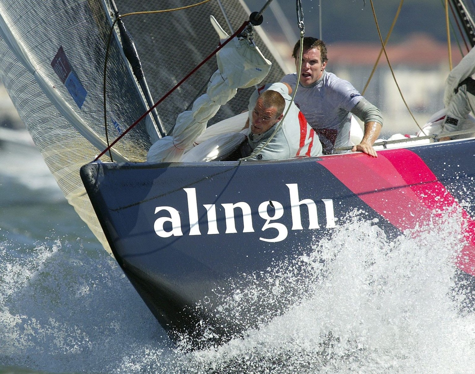 Alinghi crew prepare to hoist their spinnaker while making the turn at the mark during day four of the MOET Cup race against Oracle BMW racing on Thursday, 18 September 2003 in San Francisco, Californ ...