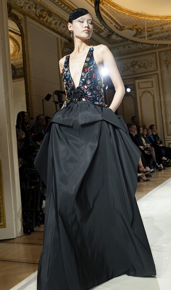 A model wears a creation as part of the Giorgio Armani Prive Haute Couture Spring Summer 2025 collection, that was presented in Paris, Tuesday, Jan. 28, 2025. (AP Photo/Lewis Joly).