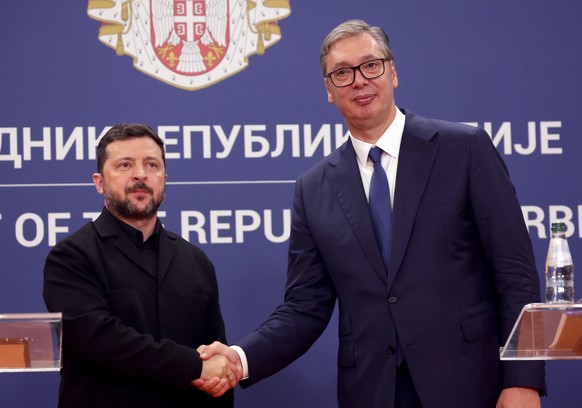 epa13156462 Serbian President Aleksandar Vucic (R) shakes hands with Ukrainian President Volodymyr Zelensky (L) during a press conference following their meeting in Belgrade, Serbia, 08 August 2026. Z ...