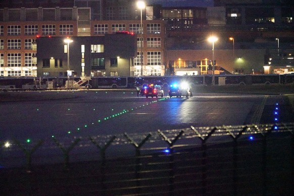 epa11495256 A handout photo made available by the Letzte Generation (Last Generation) climate group shows police vehicles during a Last Generation demonstration on a runway at the airport in Frankfurt ...