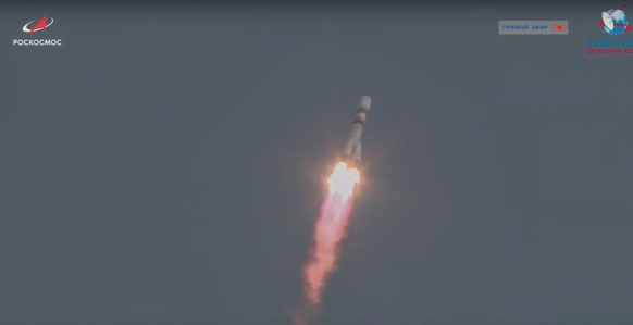 epa08383447 A handout still image taken from a video footage and made available on the official website of the Russian State Space Corporation ROSCOSMOS, shows the Russian Soyuz-2.1a carrier rocket wi ...