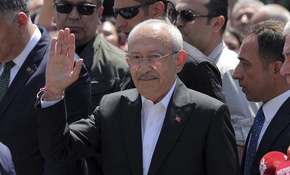 Kemal Kilicdaroglu, the 74-year-old leader of the center-left, pro-secular Republican People&#039;s Party, or CHP, waves to his supporters after voting at a polling station in Ankara, Turkey, Sunday,  ...