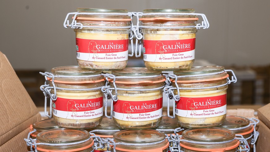 epa12582470 Several examples of duck foie gras displayed during a press visit in the poultry and meat section at the International Wholesale Food Market (MIN) in preparation for the Christmas festivit ...
