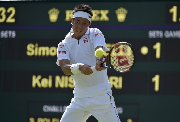 Kei Nishikori of Japan hits a shot during his match against Simone Bolelli of Italy at the Wimbledon Tennis Championships in London, June 29, 2015. REUTERS/Toby Melville