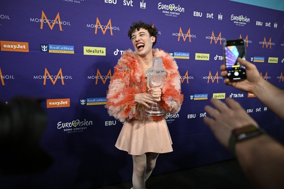 epaselect epa11334296 Nemo representing Switzerland with the song &#039;The Code&#039; poses in the press room after winning the 68th edition of the Eurovision Song Contest (ESC) at the Malmo Arena, i ...