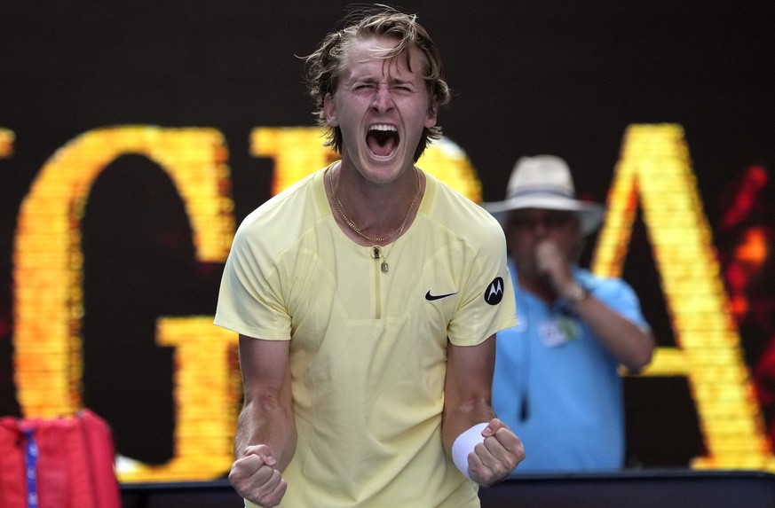 Sebastian Korda of the U.S. celebrates after defeating Hubert Hurkacz of Poland during their fourth round match at the Australian Open tennis championship in Melbourne, Australia, Sunday, Jan. 22, 202 ...