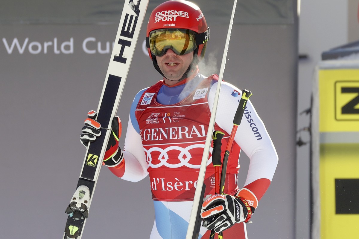 Switzerland's Beat Feuz gets to the finish area after completing an alpine ski, men's World Cup downhill, in Val d'Isere, France, Sunday, Dec. 13, 2020. (AP Photo/Alessandro Trovati)
