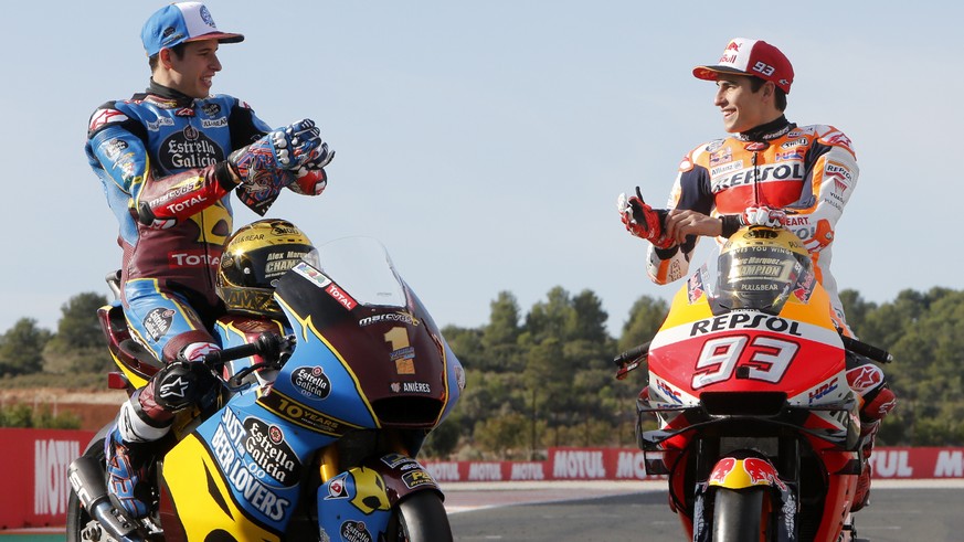 Moto2 rider Alex Marquez, left, and his brother MotoGP rider Marc Marquez, both of Spain, the 2019 World Champions, pose together before the Valencia Motorcycle Grand Prix, the last race of the season ...