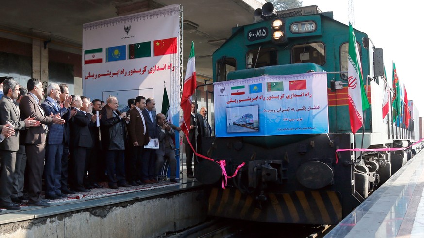 epa05161915 The first Chinese cargo train, to be used following Iran-China joint efforts to revive the Silk Road, arrives in Tehran, Iran, 15 February 2016. Reports said the 32-containers train, each  ...