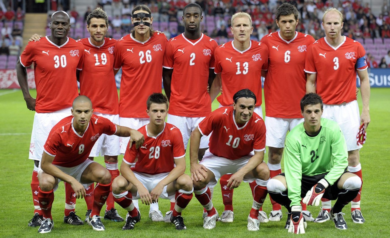 Swiss soccer players from left behind, Blaise Nkufo, Valon Behrami, Alain Nef, Johan Djourou, Stephane Grichting, Benjamin Huggel and Ludovic Magnin, in front from left, Goekhan Inler, Valentin Stocke ...