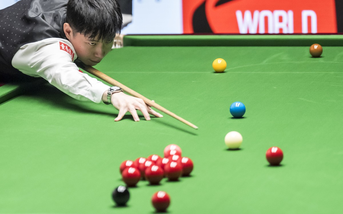 China's Zhao Xintong during his match against China's Lei Peifan on day eight of the World Snooker Championship at the Crucible Theatre, Sheffield, England, Saturday, April 26, 2025. (Danny  ...