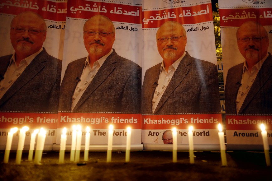 FILE - In this Oct. 25, 2018, file photo, candles, lit by activists, protesting the killing of Saudi journalist Jamal Khashoggi, are placed outside Saudi Arabia&#039;s consulate, in Istanbul, during a ...