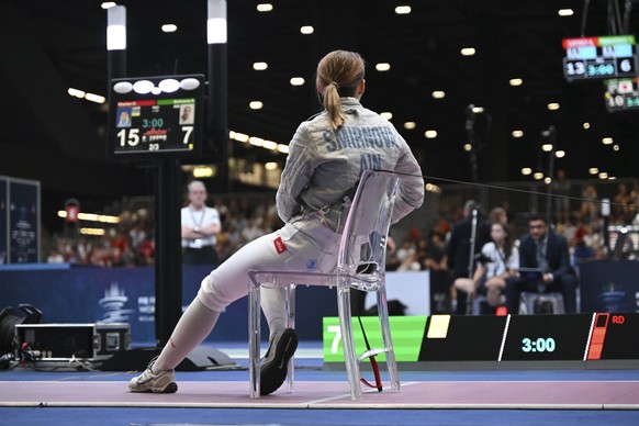 Russia&#039;s Anna Smirnova remains seated after her bout with Ukraine&#039;s Olga Kharlan in the women&#039;s individual sabre best of 64 round match at the World Fencing Championship in Milan, Italy ...