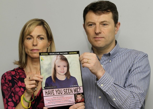 FILE - Kate and Gerry McCann pose for the media with a missing poster depicting an age progression computer generated image of their still missing daughter Madeleine during a news conference in London ...