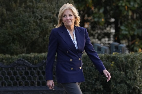 First lady Jill Biden walks out of the White House in Washington, Wednesday, Jan. 11, 2023, as she and President Joe Biden prepare to board Marine One. The White House says surgeons have removed a can ...