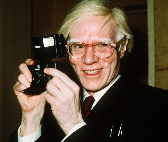 FILE - In this 1976 file photo, pop artist Andy Warhol smiles in New York. In the late 1970s, pop artist Andy Warhol and writer Truman Capote recorded dozens of hours of intimate conversations they pl ...