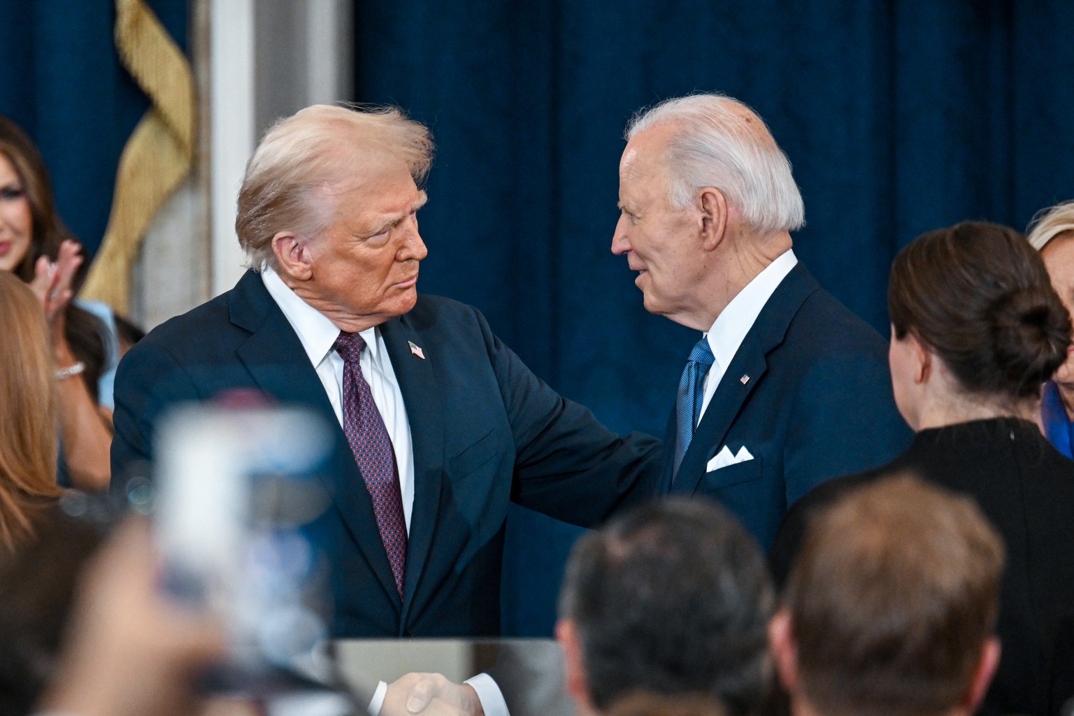 epa11839220 President-elect Donald J. Trump and US President Joe Biden attend inauguration of Donald Trump as the 47th president of the United States takes place inside the Capitol Rotunda of the U.S. ...