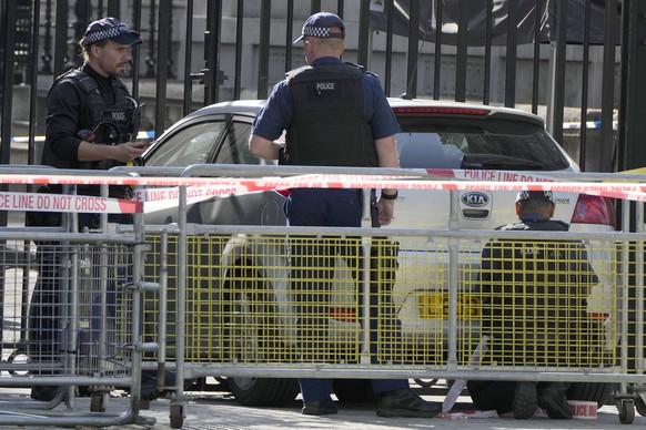 Police at the scene after a car collided with the gates of Downing Street in London in London, Thursday, May 25, 2023. Police say a car has collided with the gates of Downing Street in central London, ...