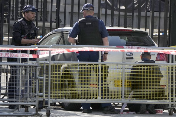 Police on scene after a car collided with the Downing Street gates in London in London, Thursday, May 25, 2023. Police say a car collided with the Downing Street gates in central London,.. .