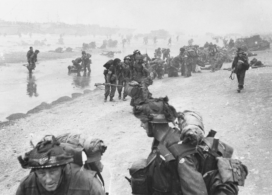 RECORD DATE NOT STATED D-Day - British Troops landing - Queen Beach - Sword Area View over Queen Beach, Sword Area at approx. 8:30am. Soldiers of No.1 Platoon, 84 Field Company RE are in the foregroun ...