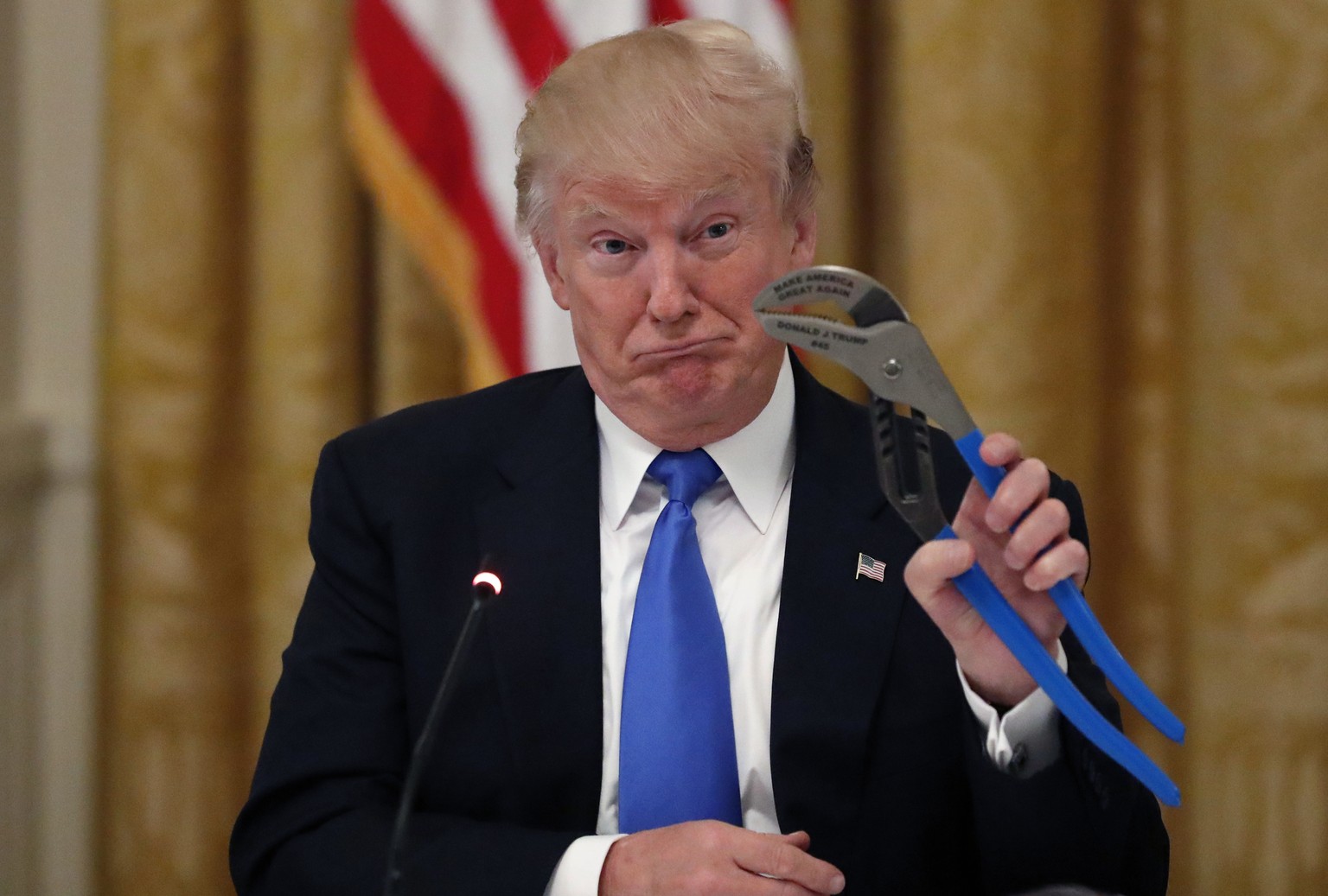 President Donald Trump holds up a Channellock locking plier during a &quot;Made in America,&quot; roundtable event in the East Room of the White House in Washington, Wednesday, July 19, 2017. (AP Phot ...