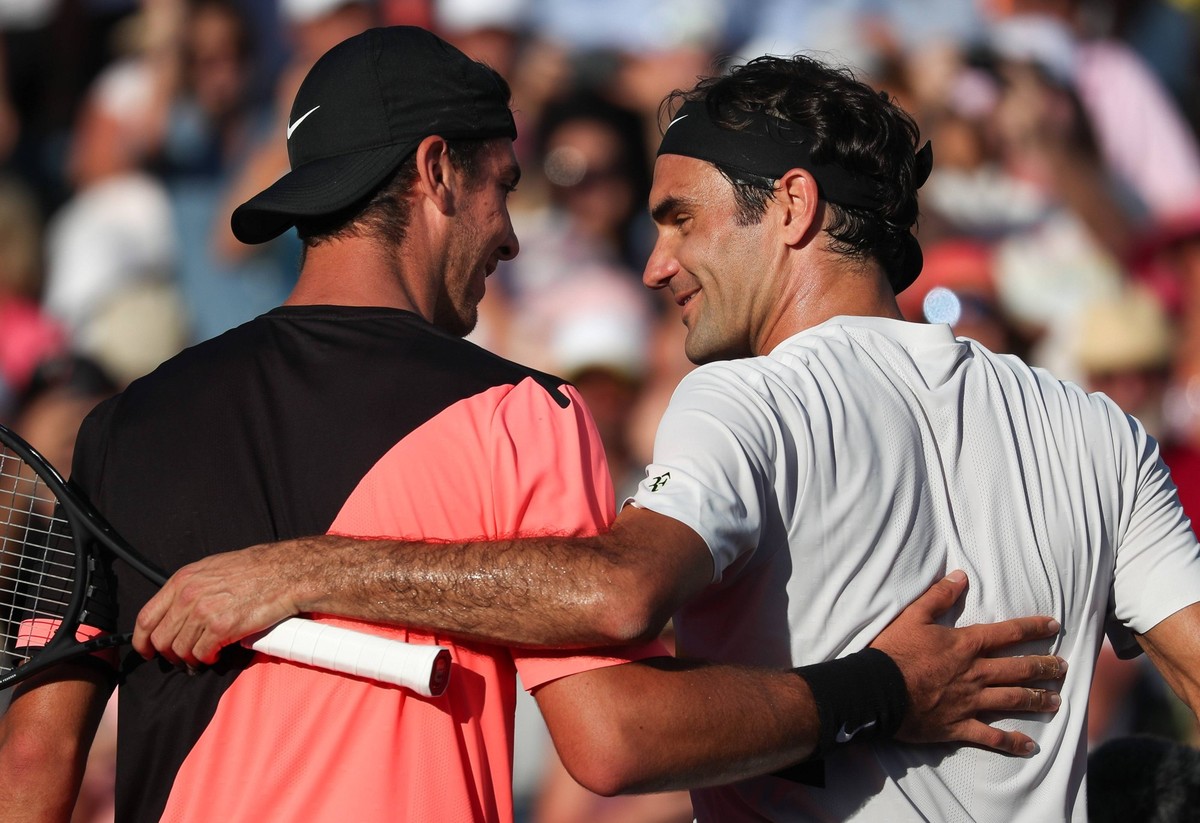 March 24, 2018 - Key Biscayne, Florida, U.S. - ROGER FEDERER from Switzerland congratulates THANASI KOKKINAKIS from Australia after being defeated by Kokkinakis in second round of the 2018 Miami Open  ...