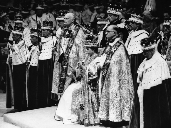 FILE - In this June 2, 1953 file photo, Britain&#039;s Queen Elizabeth II sits on a throne, during her coronation, in London. Queen Elizabeth II, Britainて longest-reigning monarch and a rock of stabi ...