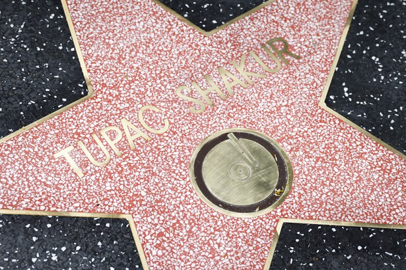 epa10678636 Tupac Shakur&#039;s Hollywood Walk of Fame star is unveiled after he posthumously received the 2,758th star on the Walk of Fame, in the category of Recording in Los Angeles, California, US ...