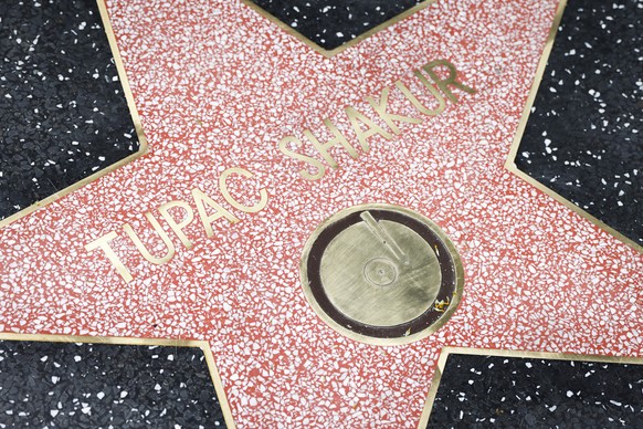 epa10678636 Tupac Shakur's Hollywood Walk of Fame star is unveiled after he was posthumously awarded the 2,758th star on the Walk of Fame, in the Inclusion category in Los Angeles, California, USA...
