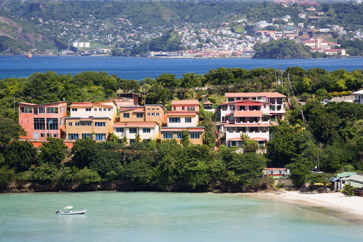 West Indies Grenada St George BBC Beach in Morne Rouge Bay lined with holiday apartment villas and the capital of St Georges in the distance Morne Rouge Bay St George Grenada EDITORIAL USE ONLY Copyri ...