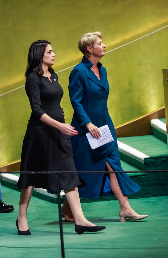 epa12402145 President of the Swiss Confederation Karin Keller-Sutter (R) arrives to speak during the General Debate of the 80th session of the United Nations General Assembly (UNGA) at the United Nati ...