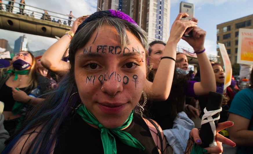 A demonstrator has make-up that reads No forgiveness and no forget as women participate in the International Womens day demonstrations in Bogota, Colombia on March 8, 2022. ChepaxBeltran/LongxVisualxP ...
